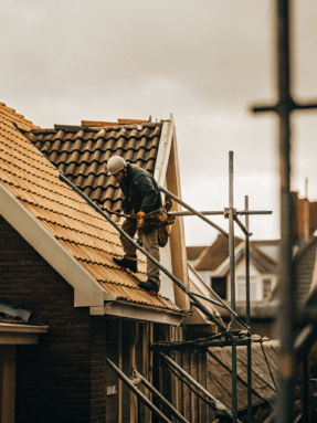 a-dutch-roofing-contractor-repairing-a-residential-2